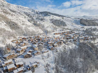 Nestled in a picturesque snow-covered mountain village, this charming property offers a serene winter escape.
