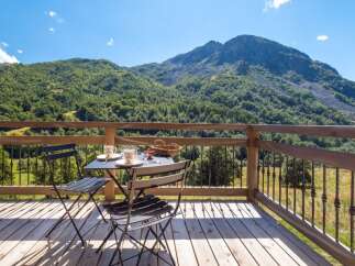 Enjoy breathtaking mountain views from this charming balcony, perfect for your morning coffee or evening relaxation.