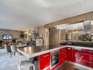 Experience the perfect blend of rustic charm and modern luxury in this stunning open-concept living space.