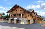 Discover this stunning wooden chalet-style property, perfect for a mountain getaway.