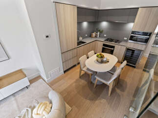 Experience modern living in this stunning kitchen and dining area, featuring sleek cabinetry and a stylish dining set perfect for intimate meals.