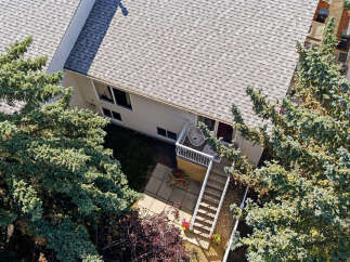 Discover this charming home featuring a spacious backyard with mature trees, perfect for outdoor enjoyment.
