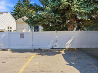 Discover this charming property featuring a private white vinyl fence, perfect for creating an exclusive outdoor space.