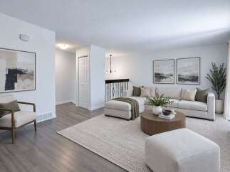 Step into this inviting living room, featuring a spacious sectional sofa perfect for gatherings and a stylish round coffee table.