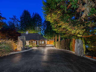 Discover this charming residence nestled amidst lush greenery, offering a serene and private retreat.