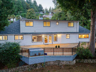 Experience outdoor living at its finest with this expansive multi-level deck, perfect for entertaining or relaxing.