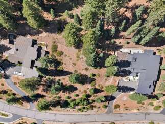 Discover this stunning modern home nestled amidst mature trees, offering a private and serene retreat.