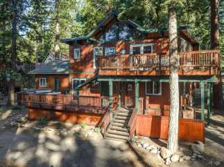 Nestled amongst towering pine trees, this charming wooden cabin offers a serene mountain retreat.