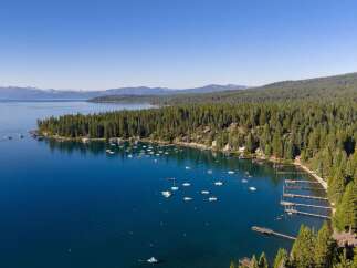 Experience luxury living on Lake Tahoe with this stunning aerial view of a waterfront property.