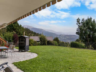 Enjoy breathtaking mountain views from this stunning property's expansive backyard, perfect for outdoor entertaining.