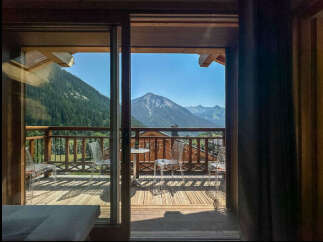 Experience breathtaking mountain views from this stunning balcony, perfect for enjoying your morning coffee or evening wine.