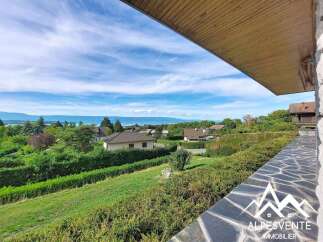 Enjoy breathtaking panoramic views of the lake and mountains from this stunning property.