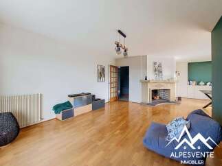 Step into this inviting living room featuring a charming fireplace and a spacious layout perfect for relaxation and entertaining.