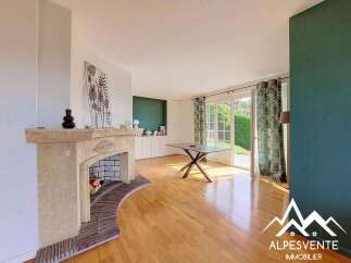 Step into this inviting living room featuring a charming stone fireplace, perfect for cozy evenings.