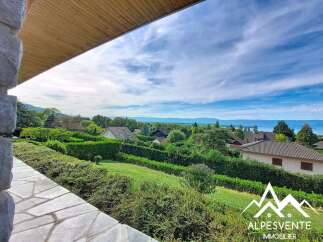 Enjoy breathtaking panoramic views of the lake and distant mountains from this stunning property.