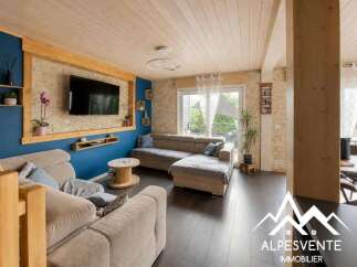 Experience modern living in this beautifully appointed living room, featuring a large sectional sofa perfect for relaxation and entertainment.