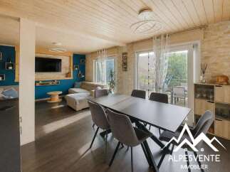 Experience modern living in this spacious open-plan dining and living area, featuring a sleek dining table and comfortable lounge seating.
