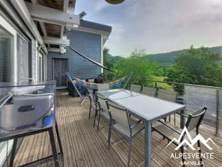 Enjoy breathtaking mountain views from this spacious deck, perfect for outdoor dining and relaxation.