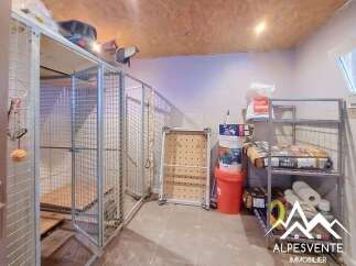 Discover this versatile space, perfect for storage or as a dedicated pet area, featuring multiple secure cages and ample shelving.