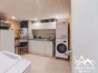 Discover this functional kitchen area, equipped with ample storage cabinets and countertop space, perfect for meal preparation.