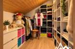 Discover this spacious walk-in closet, perfect for organizing your wardrobe.