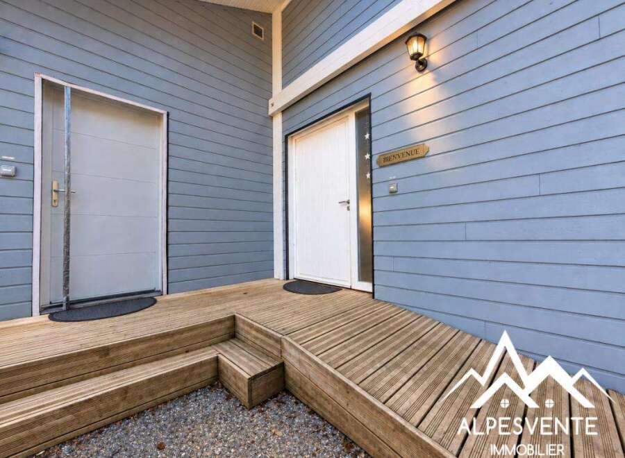 Welcome guests with this charming entrance featuring a ramp and stairs leading to two distinct doors.