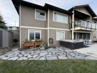 Enjoy outdoor living with this property's expansive flagstone patio, perfect for entertaining or relaxing.