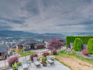 Experience luxury living with this stunning property offering breathtaking panoramic views of the valley and mountains.