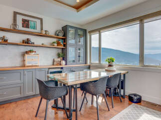 Enjoy breathtaking mountain views from this charming dining area, perfect for intimate meals or entertaining guests.