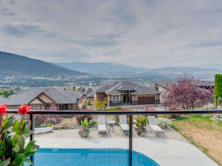 Experience luxury living with this stunning property featuring a sparkling swimming pool and breathtaking panoramic views of the valley and mountains.
