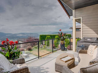 Enjoy breathtaking panoramic views from this stunning elevated deck, perfect for entertaining or quiet relaxation.