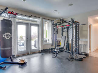 Transform your home into a personal fitness sanctuary with this fully equipped gym space.