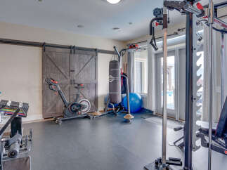 Transform your home into a personal fitness sanctuary with this fully equipped home gym.