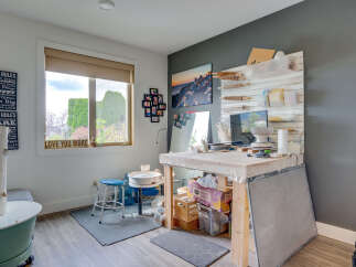 Discover a dedicated creative space in this home, perfect for pottery or art enthusiasts.