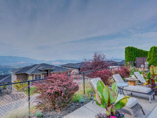 Enjoy breathtaking panoramic views from this stunning property, featuring a meticulously landscaped backyard perfect for relaxation and entertaining.