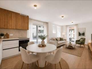Experience modern living in this beautifully appointed open-concept space, featuring a sleek kitchen with ample cabinet storage and integrated appliances.