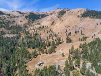 Discover this stunning mountain property, perfect for outdoor enthusiasts and those seeking a serene escape.