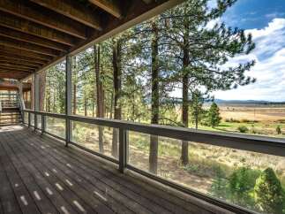 Enjoy breathtaking views from this expansive deck, perfect for entertaining or quiet relaxation.