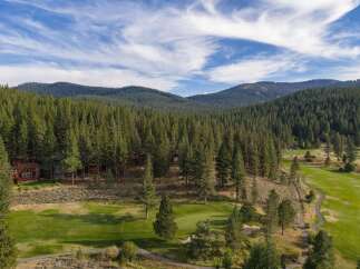 Nestled amidst a lush pine forest, this property offers a serene escape with its own private golf course.