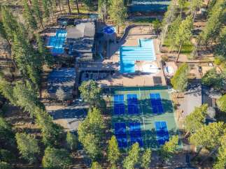 Experience resort-style living with this exceptional property featuring multiple swimming pools, including a lap pool and a circular pool with a spa.