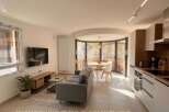 Experience modern living in this beautifully staged apartment, featuring a spacious open-plan living and dining area perfect for entertaining.