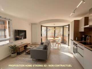 Experience modern living in this beautifully staged apartment, featuring a spacious open-plan living and dining area perfect for entertaining.