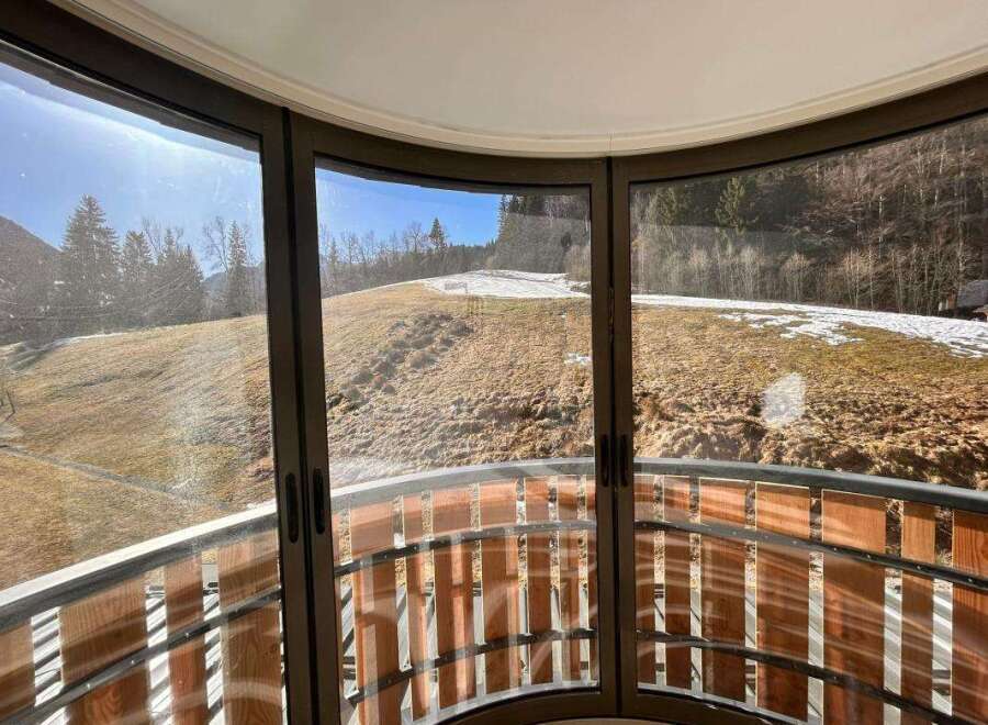 Experience breathtaking panoramic views from this unique curved balcony, offering a seamless connection to the surrounding natural landscape.