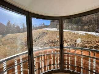 Experience breathtaking panoramic views from this unique curved balcony, offering a seamless connection to the surrounding natural landscape.