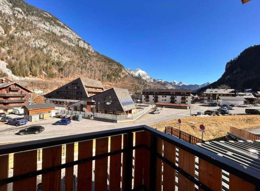 Experience mountain living in this charming property, offering stunning views of snow-capped peaks and a picturesque village setting.