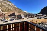 Experience mountain living in this charming property, offering stunning views of snow-capped peaks and a picturesque village setting.
