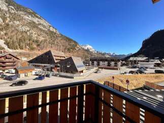 Experience mountain living in this charming property, offering stunning views of snow-capped peaks and a picturesque village setting.