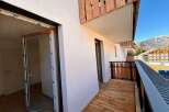 Experience modern living with this stunning property featuring a spacious balcony perfect for enjoying mountain views.