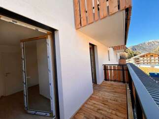Experience modern living with this stunning property featuring a spacious balcony perfect for enjoying mountain views.