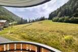Experience breathtaking mountain views from this stunning property, nestled amidst lush green hills and dense forests.